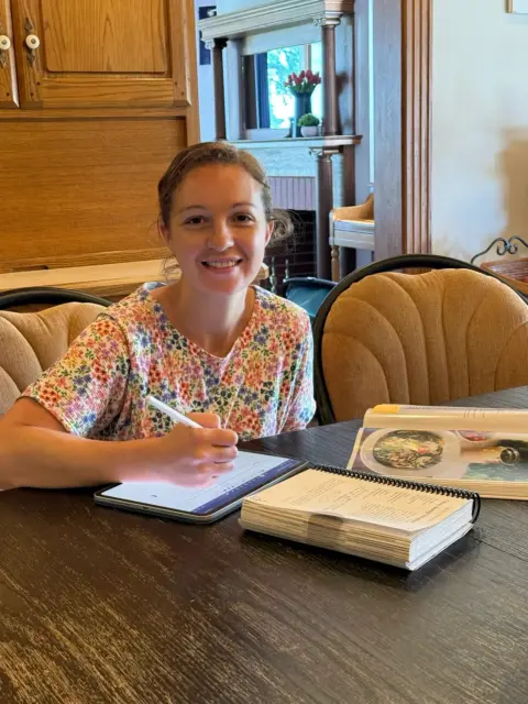 Charlotte planning her weekly meals and to-do list.