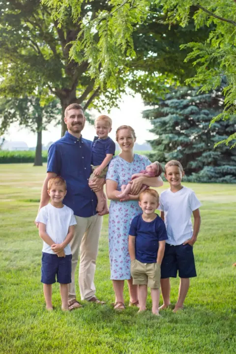 Charlotte and her happy family taking family photos.